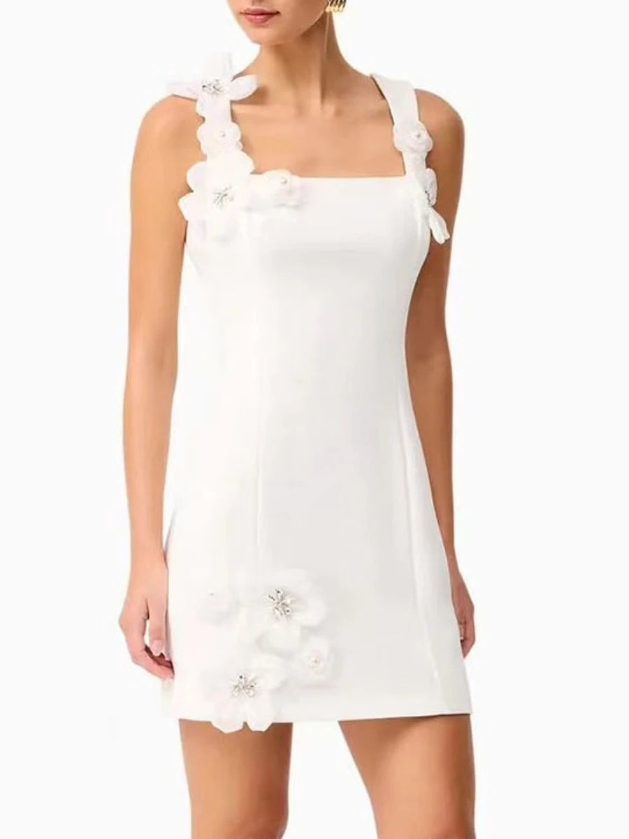 Square-neck white dress featuring floral strap appliqués