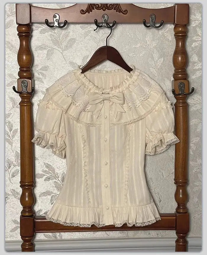 Cream lace collar blouse with bow detail and short puff sleeves