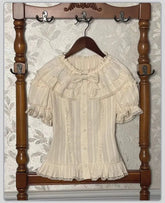 Cream lace collar blouse with bow detail and short puff sleeves