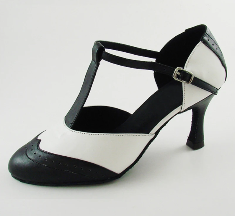 Close-up of a black and white T-strap dance heel