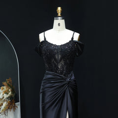 Black sequin top and satin skirt on a mannequin against a dark background