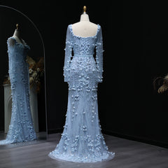 Light blue evening gown with floral embellishments on a mannequin against a dark background.