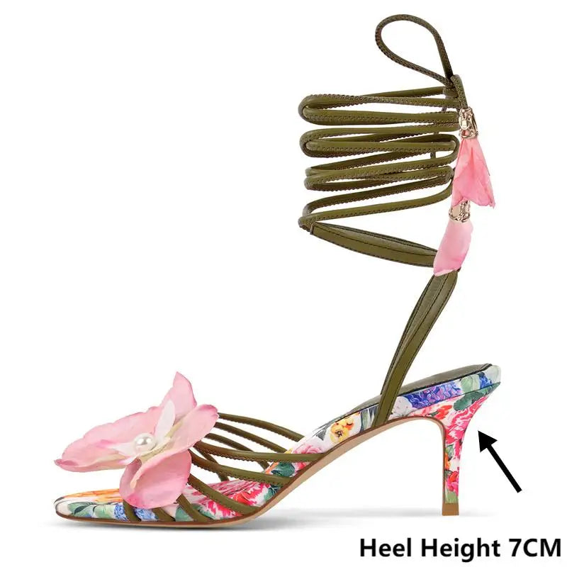 Side view of floral lace up stiletto heels with tassel detail
