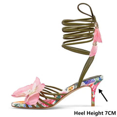 Side view of floral lace up stiletto heels with tassel detail