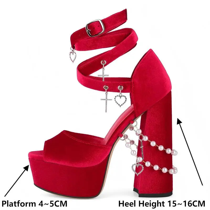 Red high-heeled shoe with platform and decorative elements on a white background