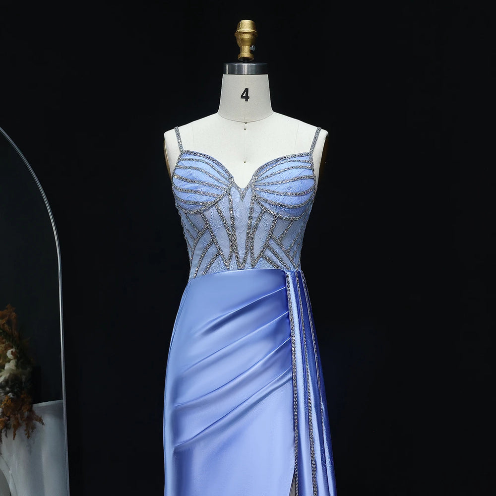 Blue evening gown on a mannequin against a black background