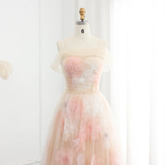 Pastel floral dress on a mannequin against a white background