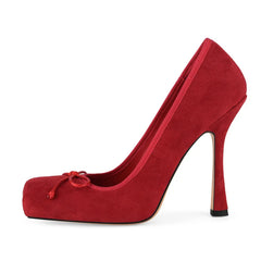 Red high-heeled shoe with a platform on a white background
