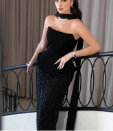 Black strapless sequin A-line prom gown with shawl.