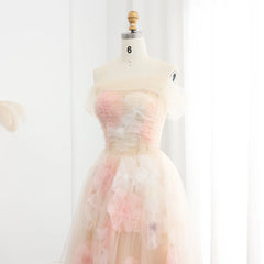 Pastel-colored dress on a mannequin against a white background