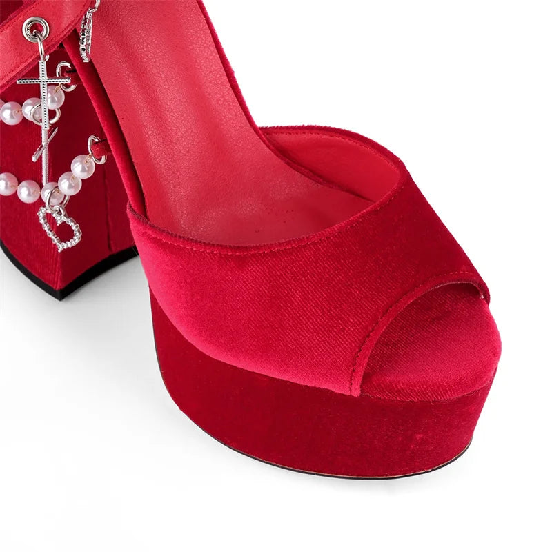 Red high-heeled shoe with open toe on a white background