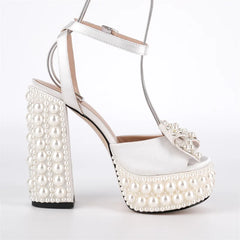 Side view of pearl embellished platform block heel sandals