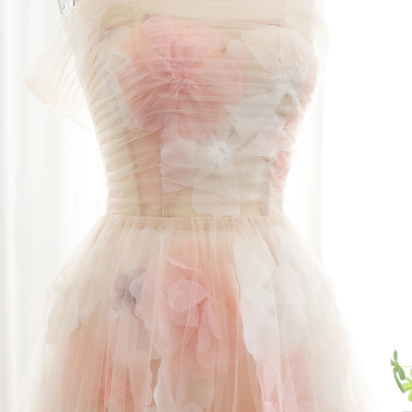 Floral dress with pink and white flowers on a light background