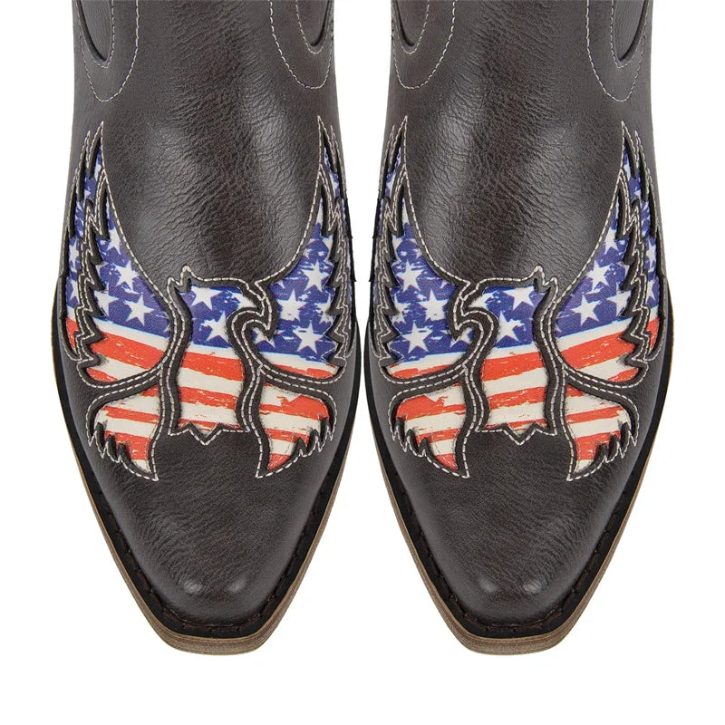 Toe detail of black embroidered wing western boots with flag embroidery