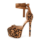 Leopard print high-heeled shoe with matching bag on a white background