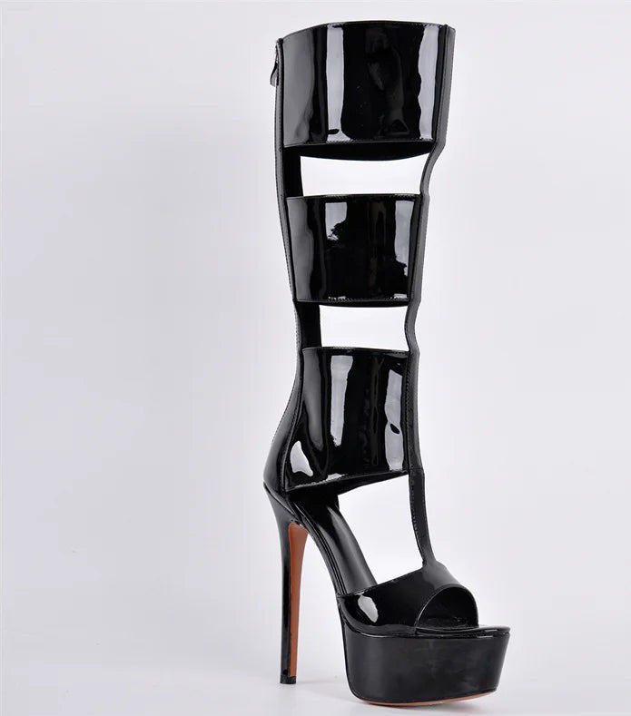 Close-up of a black patent leather knee-high gladiator boot
