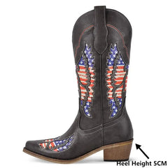 Heel height detail on black embroidered wing western boots