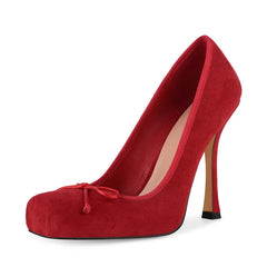 Red high-heeled shoe with a platform on a white background
