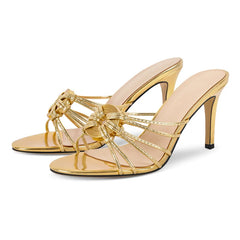 Gold metallic stiletto heel sandals with a knotted strap detail