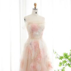 Mannequin wearing a strapless dress with floral pattern on a white background
