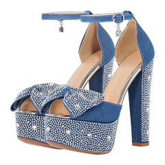 Pair of denim rhinestone peep toe platform sandals with a chunky heel and ankle strap