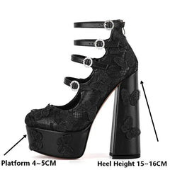 Black lace high-heeled shoes with butterfly designs on a white background