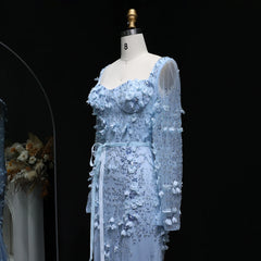 Light blue floral dress on a mannequin against a black background