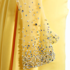 Yellow fabric with decorative beads and sequins