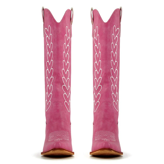 Pink western boots with white heart embroidery detail and pointed toe