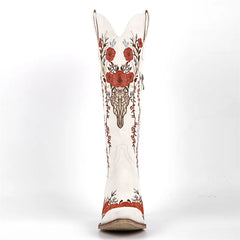 White boot with red floral embroidery on a white background