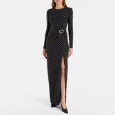 Black dress with white polka dots and a belt on a white background