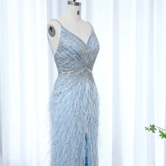 Silver beaded evening gown on a mannequin against a white background