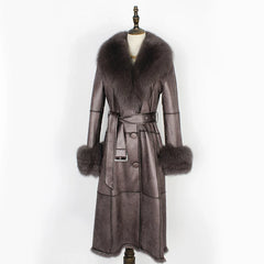Gray leather coat with fur trim on a mannequin against a white background