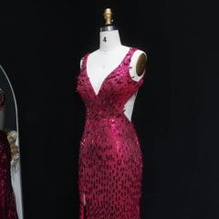 Pink sequin dress on a mannequin against a black background