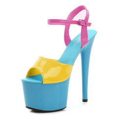 Multicolored high-heeled shoe with blue, yellow, and pink design on a white background