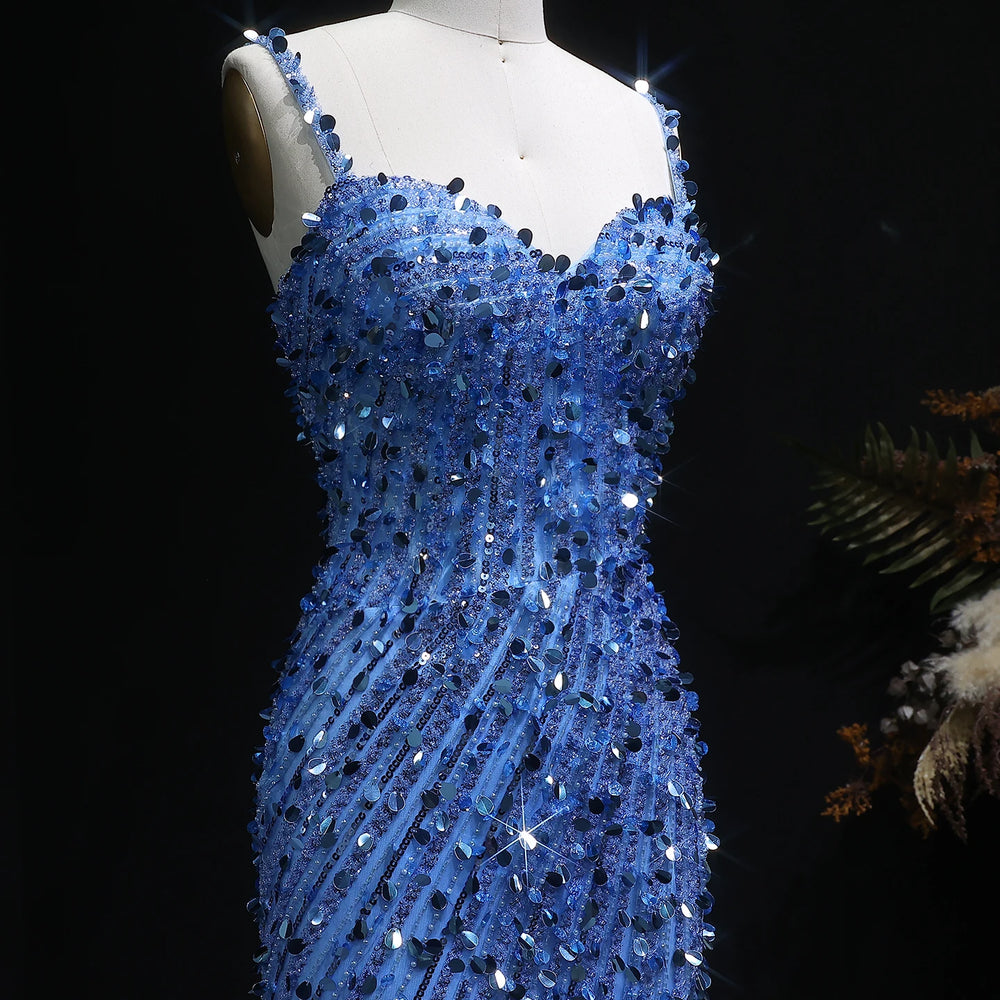 Blue sequin dress on a mannequin against a dark background