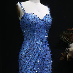 Blue sequin dress on a mannequin against a dark background
