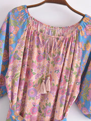 Close-up of the neckline and print on the boho floral maxi dress