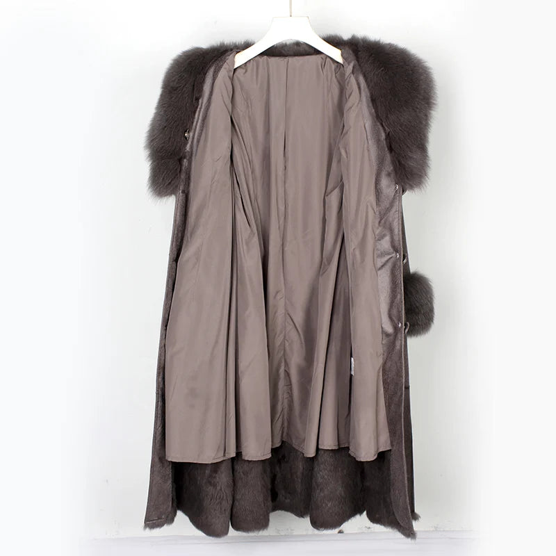 Long coat with fur trim on a white background