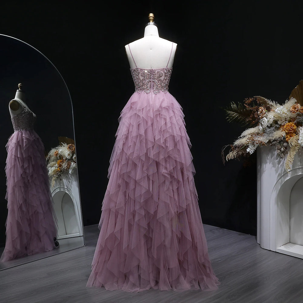 Pink evening gown on a mannequin with a dark background