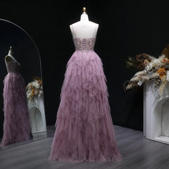 Pink evening gown on a mannequin with a dark background