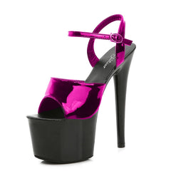 High-heeled sandal with pink metallic strap and black platform sole on a white background