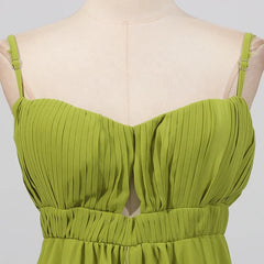 Green pleated dress on a mannequin against a plain background