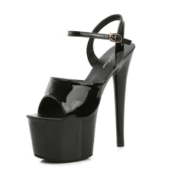 Black high-heeled platform sandal on a white background
