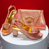 Pair of pink and gold shoes with matching handbag on a red background