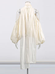 White dress on a mannequin against a white background