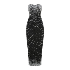 Black strapless dress with silver sequin embellishments on a white background
