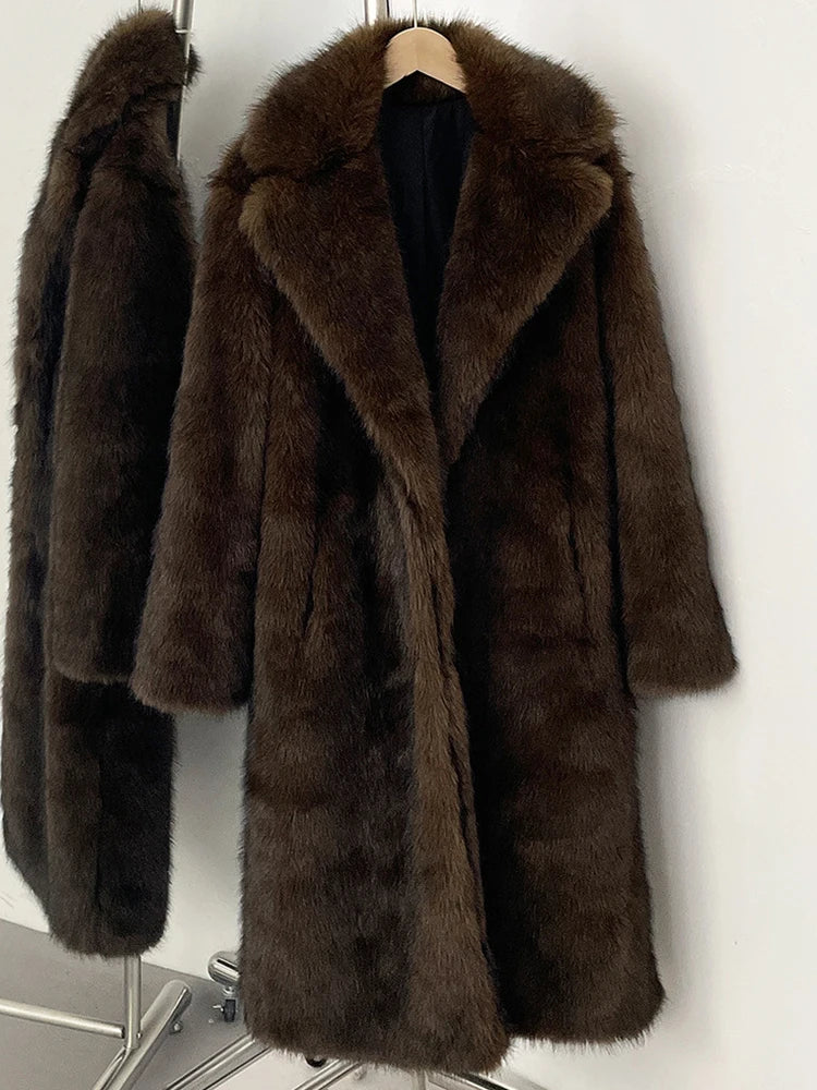 Brown fur coat on a hanger against a white wall