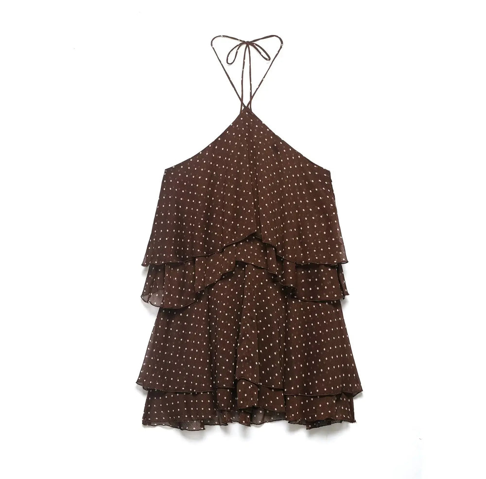 Brown polka dot dress with tiered layers on a white background