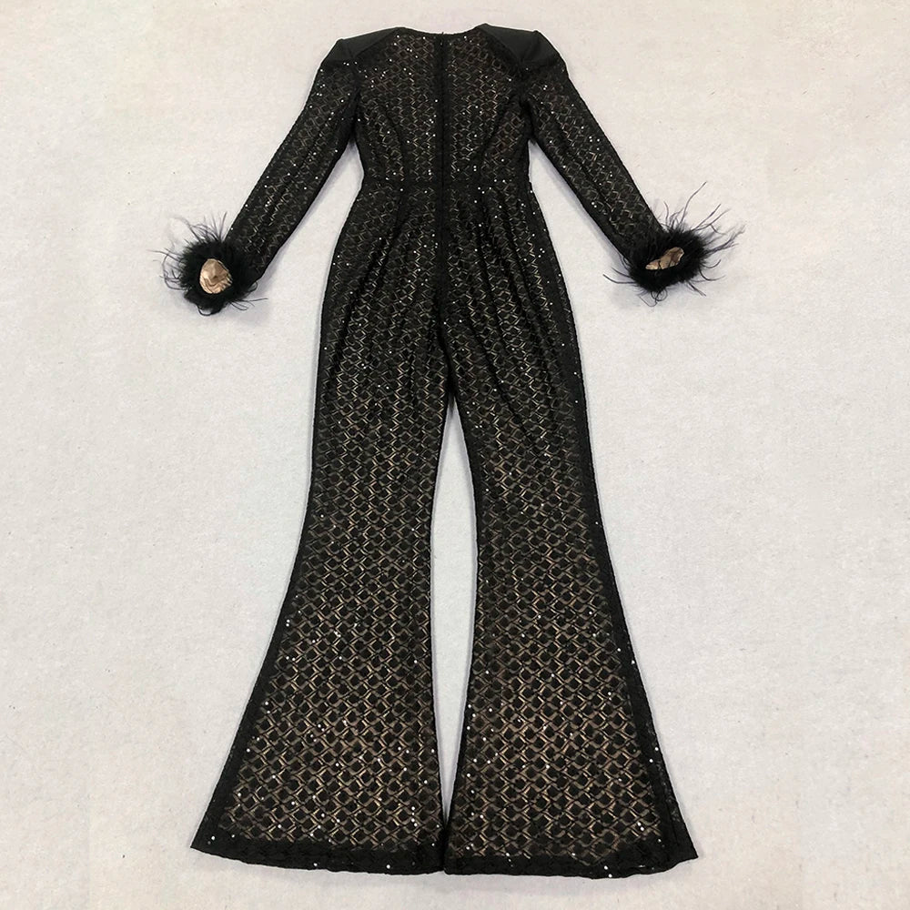 Black sequin jumpsuit with feathered sleeves on a light gray background